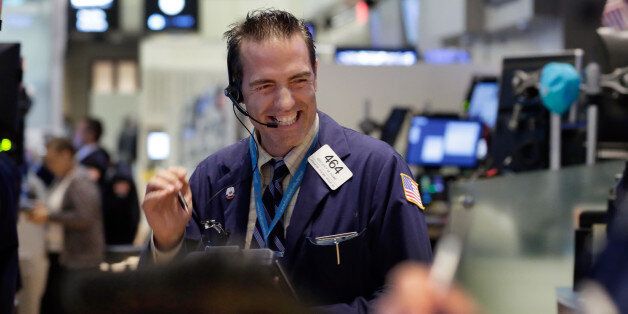 Trader Gregory Rowe works on the floor of the New York Stock Exchange, Wednesday, Aug. 26, 2015. U.S. stocks closed sharply higher, giving the stock market its best day in close to four years. The Dow Jones industrial average climbed 619 points, or 4 percent on Wednesday. (AP Photo/Richard Drew)