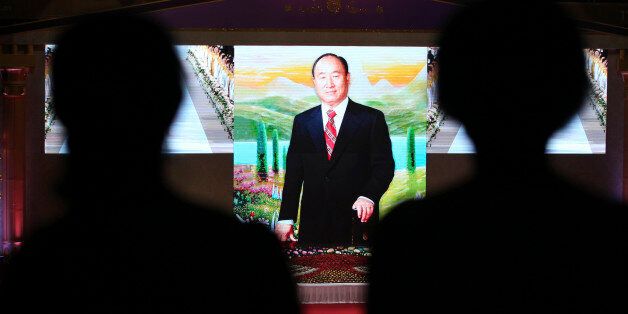 Unification Church believers attend the memorial ceremony for the first death anniversary of the late Rev. Sun Myung Moon, the founder of the Unification Church, at the CheongShim Peace World Center in Gapyeong, South Korea, Friday, Sept. 23, 2013. (AP Photo/Ahn Young-joon)