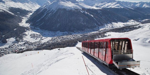 A cable train makes its way up the Weissfluhjoch mountain  in Davos, Switzerland, Monday, Jan. 19, 2015. The world's financial and political elite will head this week to the Swiss Alps for 2015's gathering of the World Economic Forum , WEF, at the Swiss ski resort of Davos. (AP Photo/Michel Euler)