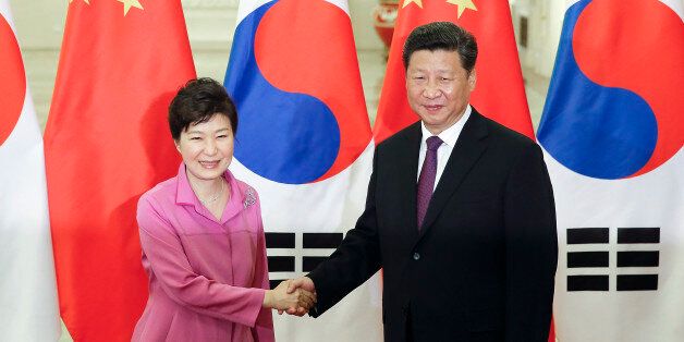 Chinese President Xi Jinping, right, shakes hands with South Korean President Park Geun-hye at the Great Hall of the People in Beijing, Wednesday, Sept. 2, 2015. World leaders are in Beijing to attend events related to China's commemoration of the 70th anniversary of the end of World War II. (Lintao Zhang/Pool Photo via AP)