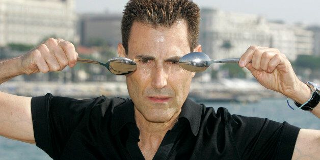 Israeli-British illusionist Uri Geller poses during the 24th MIPCOM (International Film and Program Market for Tv, Video,Cable and Satellite) in Cannes, southeastern France, Tuesday, Oct 14, 2008. (AP Photo/Lionel Cironneau)