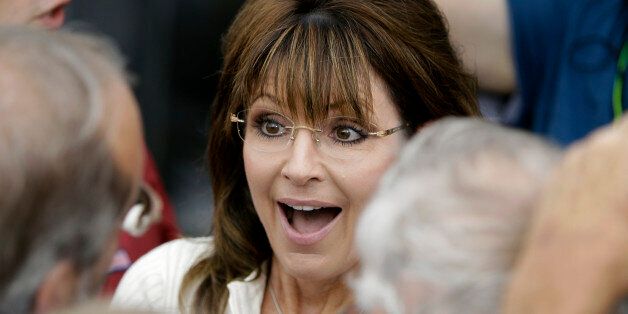 Former Alaska Gov. Sarah Palin greets supporters after speaking to Tea Party members during the Restoring America event, Saturday, Sept. 3, 2011, in Indianola, Iowa. (AP Photo/Charlie Neibergall)