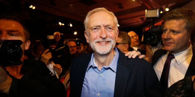 Jeremy Corbyn smiles as he leaves the stage  after he is announced as the new leader of The Labour Party during the Labour Party Leadership Conference in London, Saturday, Sept. 12, 2015. Corbyn will now lead Britain's main opposition party. (AP Photo/Kirsty Wigglesworth)