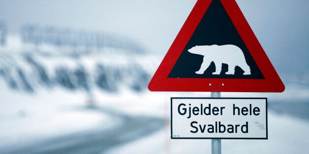 A sign warning of polar bears is seen Feb. 25, 2008 outside of Longyearbyen, Norway on the Arctic archipelago of Svalbard, as far north as you can fly on a scheduled flight. At about 78 degrees north latitude, it is less than 1,000 kilometers (620 miles) from the North Pole. (AP Photo/John McConnico)