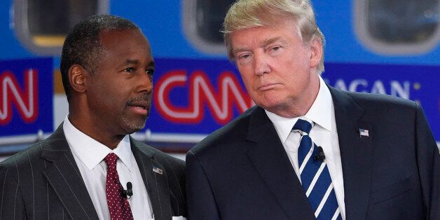 Republican presidential candidates Ben Carson, left, and Donald Trump talk before the start of the CNN Republican presidential debate at the Ronald Reagan Presidential Library and Museum on Wednesday, Sept. 16, 2015, in Simi Valley, Calif. (AP Photo/Mark J. Terrill)