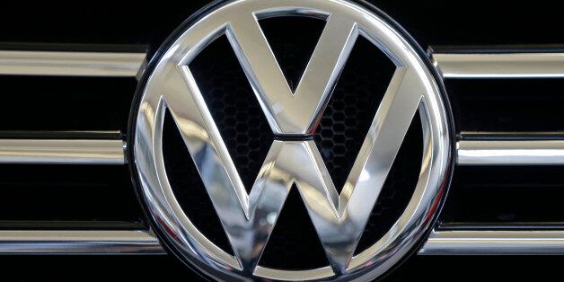 In this photo taken Feb. 14, 2013, a Volkswagen logo is seen on the grill of a Volkswagen on display in Pittsburgh. The Environmental Protection Agency (EPA)  says nearly 500,000 Volkswagen and Audi diesel cars built in the past seven year are intentionally violating clean air standards by using software that evades EPA emissions standards. (AP Photo/Gene J. Puskar)