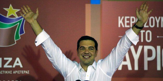 Alexis Tsipras the leader of left-wing Syriza party waves to his supporters after the election results at the partyâs main electoral center in Athens, Sunday, Sept. 20, 2015. Jubilant supporters of Alexis Tsipras' left-wing Syriza party cheered, waved party flags and danced Sunday after the party comfortably won Greece's third national vote this year despite a party rebellion over his acceptance of a painful third international bailout.(AP Photo/Lefteris Pitarakis)