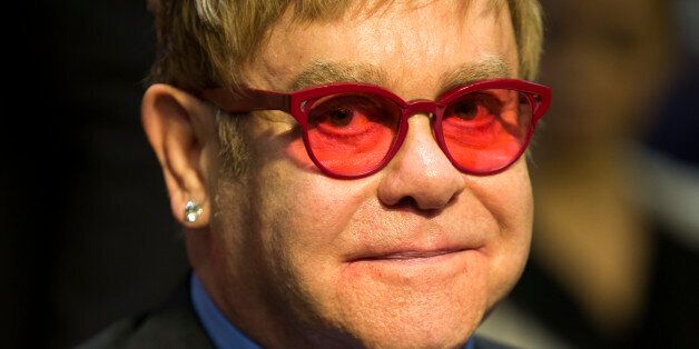 Musician Sir Elton John arrives on Capitol Hill in Washington, Wednesday, May 6, 2015, to testify before the Senate State, Foreign Operations, and Related Programs subcommittee in support of U.S. funding for global HIV/AIDS treatment. (AP Photo/Evan Vucci)