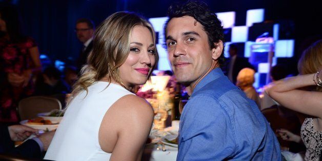 Kaley Cuoco, left, and Ryan Sweeting pose in the audience at the 22nd annual