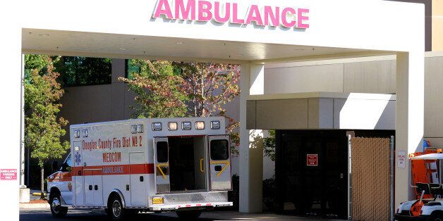 An ambulance sits outside of Mercy Medical Hospital where victims were taken following a deadly shooting at Umpqua Community College in Roseburg, Ore., Thursday, Oct. 1, 2015.  (AP Photo/Ryan Kang)
