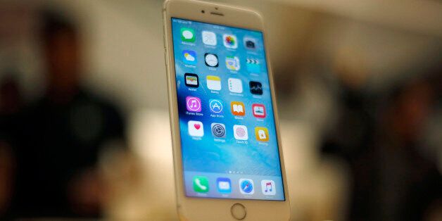 A new Apple iPhone 6S is displayed at an Apple store on Chicago's Magnificent Mile, Friday, Sept. 25, 2015, in Chicago. (AP Photo/Kiichiro Sato)