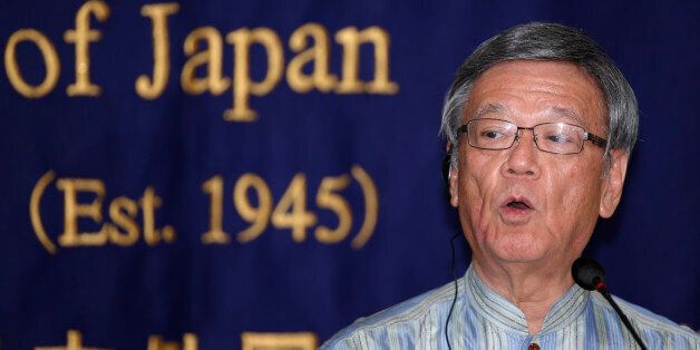 Okinawa Gov. Takeshi Onaga speaks during a press conference at the Foreign Correspondents' Club of Japan in Tokyo Wednesday, May 20, 2015. Onaga said in an interview with The Associated Press Wednesday that he would head to Washington to convey local objections to a plan to relocate a U.S. air base. A plan set in 1996 would move U.S. Marine Air Station Futenma to a less developed area of Okinawa island. (AP Photo/Shizuo Kambayashi)