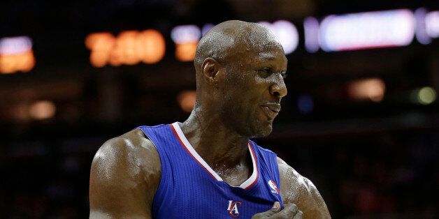 Los Angeles Clippers' Lamar Odom waits during a time-out during an NBA basketball game against the Cleveland Cavaliers Friday, March 1, 2013, in Cleveland. (AP Photo/Tony Dejak)