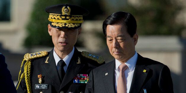 South Korean Defense Minister Han Min-koo, right, arrives at the Pentagon for the full military honors parade to welcome the visiting South Korean President Park Geun-hye to the Pentagon, Thursday, Oct. 15, 2015.   (AP Photo/Manuel Balce Ceneta)