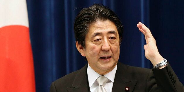 Japanese Prime Minister Shinzo Abe speaks during a press conference at the prime minister's official residence  in Tokyo, Wednesday, Oct. 7, 2015.   Prime Minister Abe has reshuffled his Cabinet to focus on reviving the world's No. 3 economy.  A newly appointed minister will steer programs aimed at achieving a strong economy and increased birth rate so the population stabilizes and the country can stay afloat. (AP Photo/Koji Sasahara)