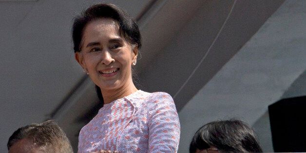 Myanmar's opposition leader Aung San Suu Kyi smiles after delivering a speech in Yangon, Myanmar, Monday, Nov. 9, 2015. Suu Kyi on Monday hinted that her party will win the country's historic elections, and urged supporters not to provoke their losing rivals. (AP Photo/Gemunu Amarasinghe)
