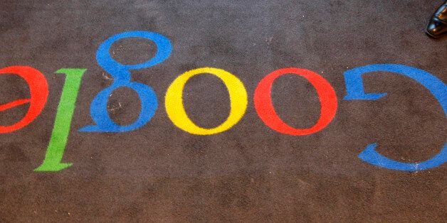 FILE - In this Dec.6, 2011 file photo, the Google logo is seen on the carpet at Google France offices before its inauguration, in Paris. Publishers in France, Germany and Italy want their governments to impose a