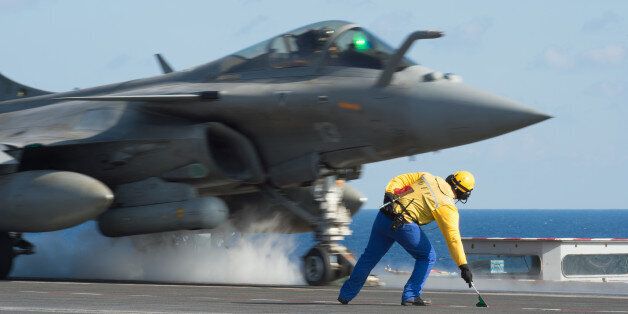 CAPTION CORRECTS THE SLUG - This photo released on Monday, Nov. 23, 2015 by the French Army Communications Audiovisual office (ECPAD) shows a French army Rafale fighter jet taking off from the deck of France's aircraft carrier Charles De Gaulle, in the Mediterranean sea. The French Defense Ministry says it has launched its first airstrikes from the aircraft carrier Charles de Gaulle, bombing Islamic State targets in the Iraqi cities of Ramadi and Mosul. (Defense Ministry/ECPAD via AP)       THIS