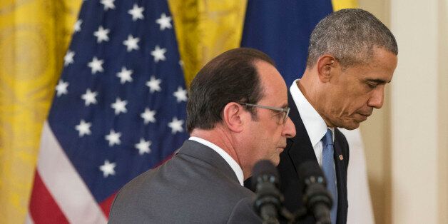President Barack Obama and French President Francois Hollande walk off stage at the end of their news conference in the East Room of the White House in Washington, Tuesday, Nov. 24, 2015. Pledging solidarity after the Paris attacks, President Barack Obama promised Tuesday to work with France and other allies to intensify the U.S.-led campaign against the Islamic State, saying America will not be cowed by the scourge of terrorism.  (AP Photo/Pablo Martinez Monsivais)