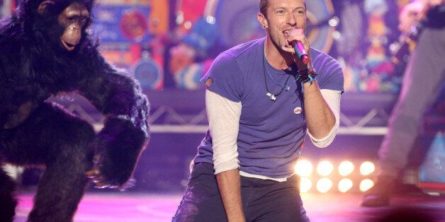 Chris Martin of Coldplay performs at the American Music Awards at the Microsoft Theater on Sunday, Nov. 22, 2015, in Los Angeles. (Photo by Matt Sayles/Invision/AP)