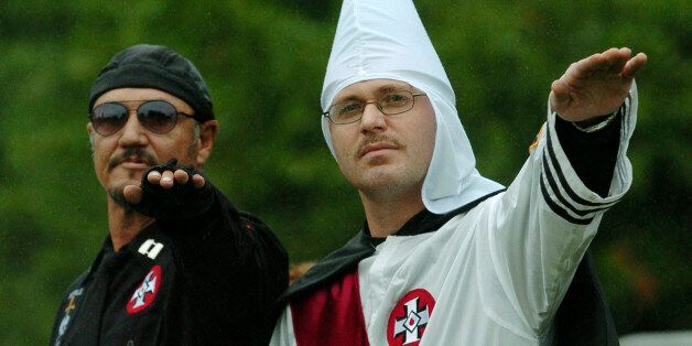 Members of the World Order of the Ku Klux Klan give a salute during a protest rally at the Gettysburg National Military Park Saturday, Sept. 2, 2006 in Gettysburg, Pa. The KKK fielded 25 members for the event and their were no incidents. (AP Photo/Bradley C Bower)