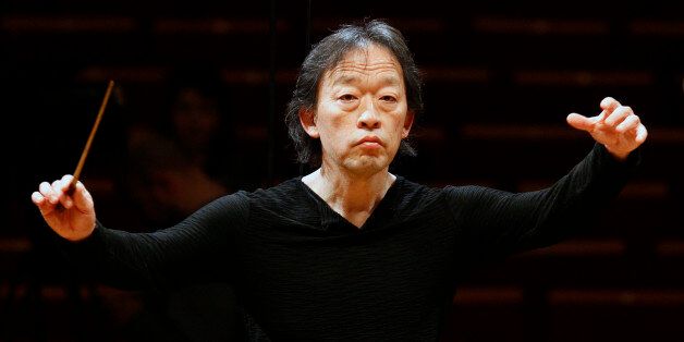 South Korean conductor Chung Myung-whun directs the last rehearsal of members of North Korea's Unhasu Orchestra with the Radio France Philharmonic Orchestra in Paris, Wednesday, March 14, 2012. Chung Myung-whun invited North Korea's Unhasu Orchestra for a unique joint concert with the Radio France Philharmonic Orchestra in Paris on Wednesday night at the Salle Pleyel Concert Hall. (AP Photo/Francois Mori)