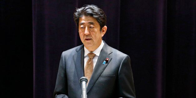 Japanese Prime Minister Shinzo Abe addresses the senior officers of Japan's self defense forces at the Defense Ministry in Tokyo, Wednesday, Dec. 16, 2015. (AP Photo/Shuji Kajiyama)