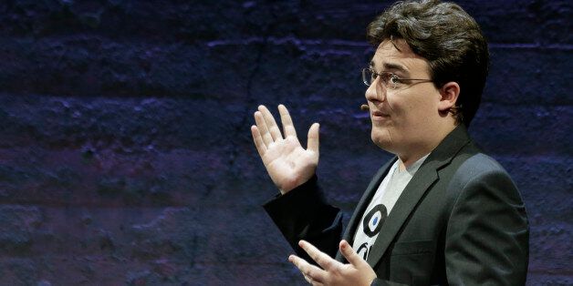 Oculus Founder Palmer Luckey talks about the Rift virtual-reality headset during a news conference Thursday, June 11, 2015, in San Francisco. Oculus is expanding its highly anticipated virtual-reality headset to simulate the sensation of touch and gesturing as part of its quest to blur the lines between the fake and genuine world. (AP Photo/Eric Risberg)