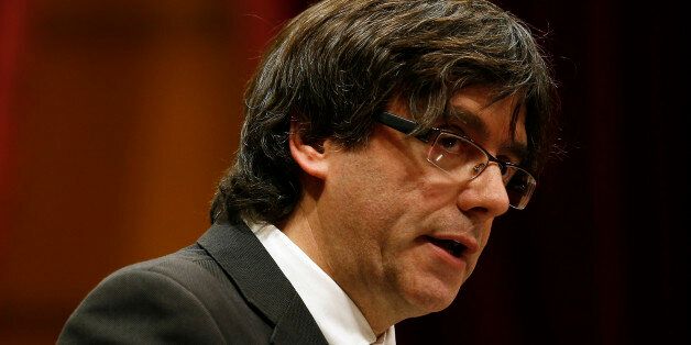 Incoming Catalan President Carles Puigdemont speaks during the investiture session at the Catalonian parliament in Barcelona, Spain, Sunday, Jan. 10, 2016. Catalonia's pro-independence parties have agreed to appoint a new leader to enable the creation of a regional coalition government and reinvigorate a push for independence from Spain by 2017. Carles Puigdemont was selected Saturday to replace Artur Mas as the
