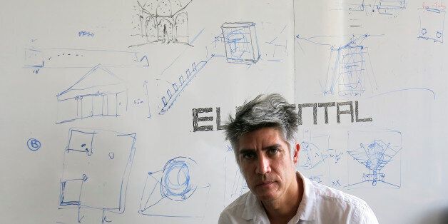 Chilean architect Alejandro Aravena poses for a photo at his studio in Santiago, Chile, Tuesday, Jan. 12, 2016. Aravena has been named the 2016 recipient of the Pritzker Prize. (AP Photo/Eva Vergara)