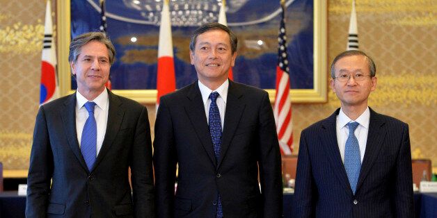 From left, U.S. Deputy Secretary of State Antony Blinken, Japanese Vice Foreign Minister Akitaka Saiki and South Korean First Vice Foreign Minister Lim Sung-nam pose prior to their talks in Tokyo Saturday, Jan. 16, 2016. The trilateral subcabinet-level meeting was held following North Korea's H-bomb claim. (Kazuhiro Nogi/Pool Photo via AP)