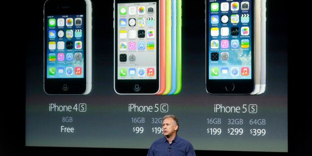 Phil Schiller, Apple's senior vice president of worldwide product marketing, speaks on stage during the introduction of the new iPhone 5c and 5s in Cupertino, Calif., Tuesday, Sept. 10, 2013. (AP Photo/Marcio Jose Sanchez)