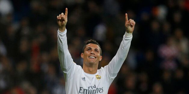 Real Madrid's Cristiano Ronaldo,left, celebrates after scoring his side's fifth goal during the Spanish La Liga soccer match between Real Madrid and Espanyol at the Santiago Bernabeu stadium in Madrid, Sunday, Jan. 31, 2016. (AP Photo/Francisco Seco)