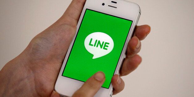 A smart phone is shown with messaging app Line in Seoul, South Korea, Wednesday, July 16, 2014. Naver Corp. said its subsidiary Line Corp. that operates a popular mobile messaging app is considering listing its shares in Tokyo or New York. Naver, South Korea's largest Internet company, said Wednesday that Line could sell shares in an initial public offering in both Japan and the U.S. (AP Photo/Lee Jin-man)