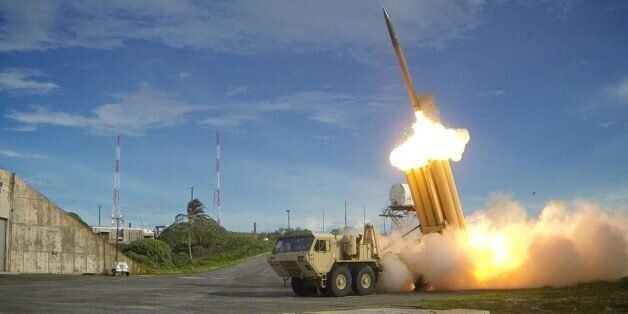The first of two Terminal High Altitude Area Defense (THAAD) interceptors is launched during a successful intercept test. The test, conducted by Missile Defense Agency (MDA), Ballistic Missile Defense System (BMDS) Operational Test Agency, Joint Functional Component Command for Integrated Missile Defense, and U.S. Pacific Command, in conjunction with U.S. Army Soldiers from the Alpha Battery, 2nd Air Defense Artillery Regiment, U.S. Navy sailors aboard the guided missile destroyer USS Decatur (D
