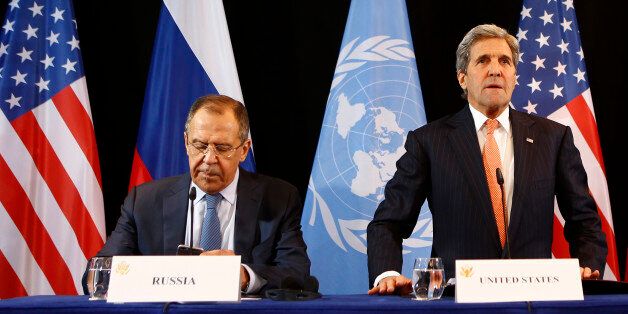 U.S. Secretary of State John Kerry, right, and Russian Foreign Minister Sergey Lavrov arrive for a news conference after the International Syria Support Group (ISSG) meeting in Munich, Germany, Friday, Feb. 12, 2016. (AP Photo/Matthias Schrader)