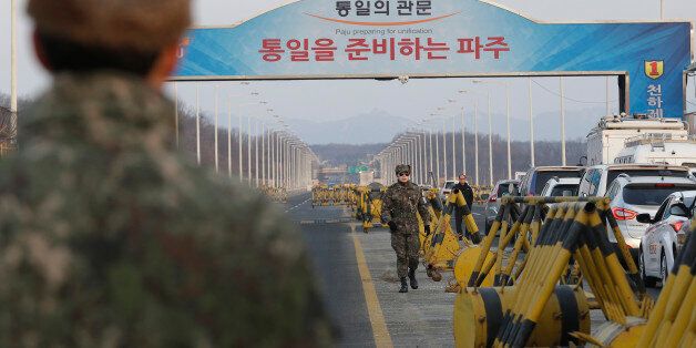 A South Korean army soldier walks on Unification Bridge, which leads to the demilitarized zone, near the border village of Panmunjom in Paju, South Korea, Thursday, Feb. 11, 2016. South Korea said Wednesday that it will shut down a joint industrial park with North Korea in response to its recent rocket launch, accusing the North of using hard currency from the park to develop its nuclear and missile programs. (AP Photo/Ahn Young-joon)