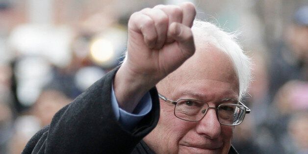 Democratic presidential candidate Sen. Bernie Sanders, I-Vt., raises a fist as he arrives for a breakfast meeting with Al Sharpton at Sylvia's Restaurant, Wednesday, Feb. 10, 2016, in the Harlem neighborhood of New York. Sanders defeated former Secretary of State Hillary Clinton on Tuesday in the New Hampshire primary. (AP Photo/Seth Wenig)