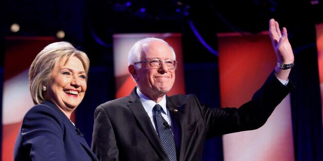 Democratic presidential candidates Hillary Clinton, left, and Sen. Bernie Sanders, I-Vt, pose for a photo before debating at the University of New Hampshire Thursday, Feb. 4, 2016, in Durham, N.H. (AP Photo/Jim Cole)