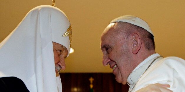 The head of the Russian Orthodox Church Patriarch Kirill, left,  and Pope Francis meet at the Jose Marti airport in Havana, Cuba, Friday, Feb. 12, 2016. This is the first-ever papal meeting with the head of the Russian Orthodox Church, a historic development in the 1,000-year schism within Christianity. (Max Rossi/Pool photo via AP)