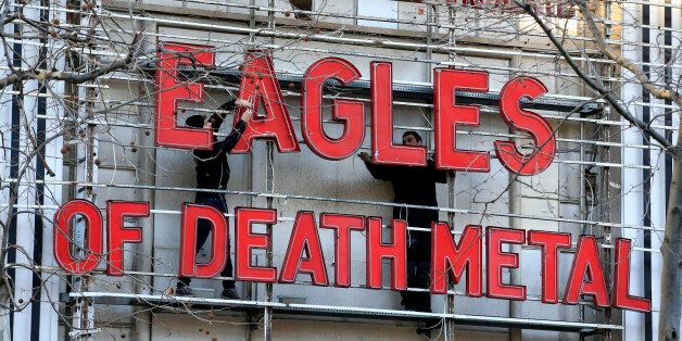 Workers set up ahead a Tuesday's concert by Eagles of Death Metal, at the Olympia music hall, in Paris, Tuesday, Feb. 16, 2016. Survivors of November's deadly Paris attacks have opened up to a French terrorism commission ahead of a highly charged concert in the French capital by Eagles of Death Metal â the U.S. rock band whose show in the Bataclan concert hall was among the attack targets. (AP Photo/Thibault Camus)