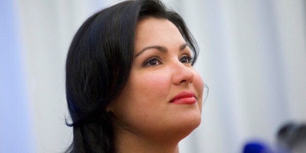 Russian leading operatic soprano Anna Netrebko speaks at a news conference in Moscow on Tuesday, June 18, 2013. Netrebko and Russian leading baritone opera singer Dmitry Khvorostovsky will take part in a concert  at Moscow's Red Square on Wednesday.   (AP Photo/Ivan Sekretarev)