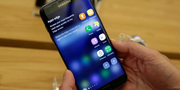 A Samsung Galaxy S7 Edge mobile phone is displayed during a preview of Samsung's flagship store, Samsung 837, in New York's Meatpacking District, Monday, Feb 22, 2016. Samsung is opening what it calls a