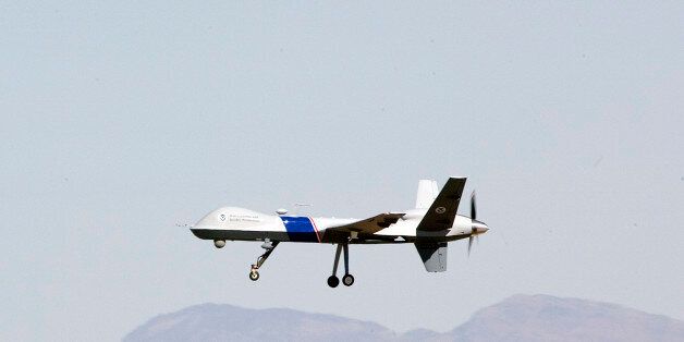 The new U.S. Customs and Border Protection unmanned aircraft the MQ-9 Predator is shown in flight at Fort Huachuca Army base, in Sierra Vista, Ariz., Monday, Oct. 30, 2006. (AP Photo/John Miller)