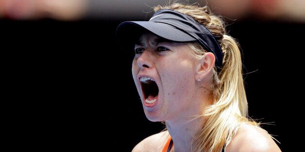 Maria Sharapova of Russia celebrates after winning a point against Serena Williams of the United States during their quarterfinal match at the Australian Open tennis championships in Melbourne, Australia, Tuesday, Jan. 26, 2016.(AP Photo/Aaron Favila)