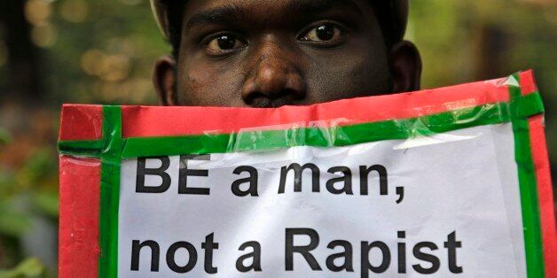 A man holds a placard as Indian Christians and others condemn the gang rape of a nun at a Christian missionary school in eastern India in Kolkata, India, Monday, March 16, 2015. According to police a nun in her 70s was gang-raped by a group of bandits when she tried to prevent them from committing a robbery in the Convent of Jesus and Mary School in West Bengal state's Nadia district. The attack early Saturday is the latest crime to focus attention on the scourge of sexual violence in India. (AP