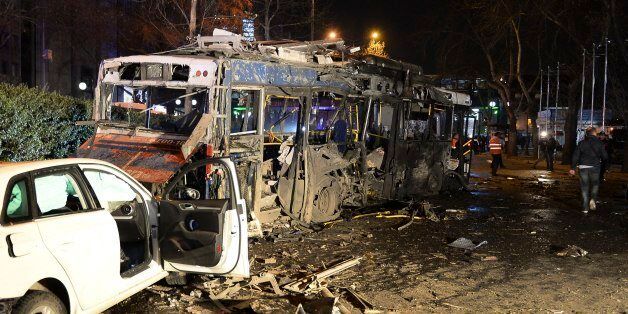 Damaged vehicles are seen at the scene of an explosion in Ankara, Turkey, Sunday, March 13, 2016. The explosion is believed to have been caused by a car bomb that went off close to bus stops. News reports say the large explosion in the capital has caused several casualties. (Selahattin Sonmez/Hurriyet Daily via AP) TURKEY OUT