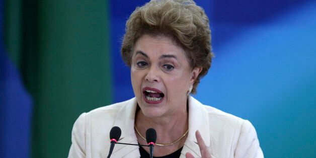 Brazil's President Dilma Rousseff speaks during a ceremony in which her predecessor, Luiz Inacio Lula da Silva, was sworn in as chief of staff, at the Planalto presidential palace, in Brasilia, Brazil, Thursday, March 17, 2016. Rousseff insisted Silva would help put the troubled country back on track and denounced attempts to oust her. (AP Photo/Eraldo Peres)