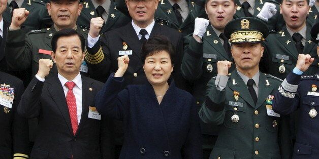 GYERYONG, SOUTH KOREA - MARCH 04:  South Korean President Park Geun-Hye cheers with new military officers during a military commissioning ceremony at Gyeryongdae, South Korea's main military compound on March 4, 2016 in Gyeryong, South Korea. Total 6003 graduates from the country's six major military academies were commissioned at the ceremony. REUTERS/Chung Sung-Jun/Pool