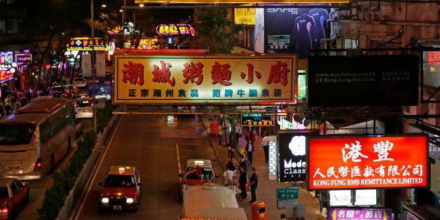 Colorful neon signs are lighted at Hong Kong's Wan Chai red light district Wednesday, Nov. 5, 2014. For generations of Western men, Hong Kongâs Wan Chai neighborhood captured all the mystery and hedonism of this financial capital known around the world as the Pearl of the Orient. Prostitutes, strippers and bar girls entertained visiting sailors and businessmen at all hours in these neon-filled blocks, even as working-class Hong Kongers went about their business in the streets around them. N